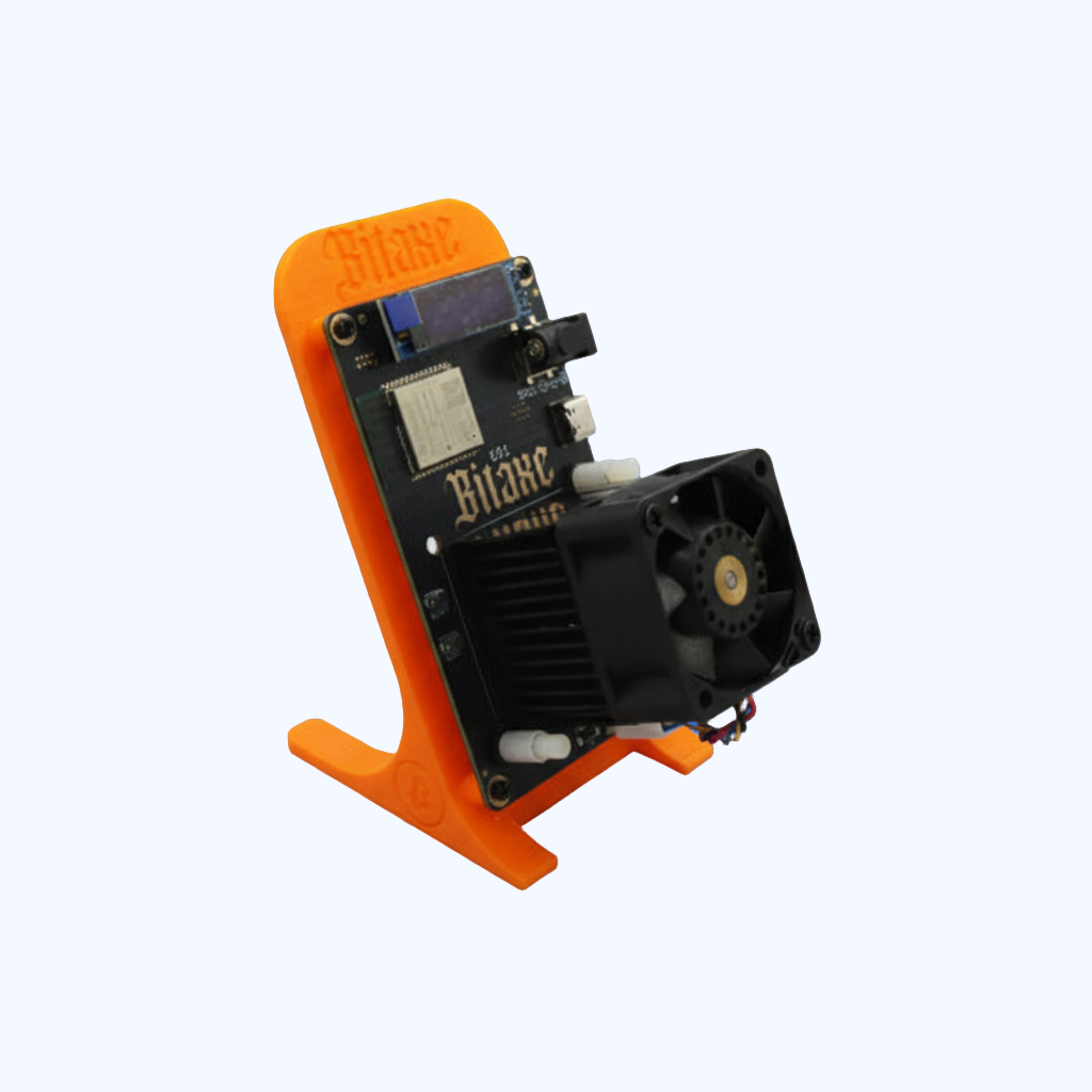 Electronic device with 'Bitaxe' branding on an orange stand against a blue background